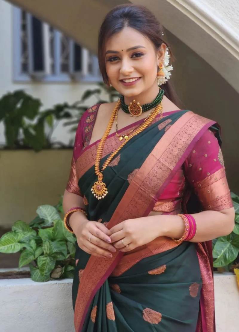 Bottle Green Saree With A Pink Blouse