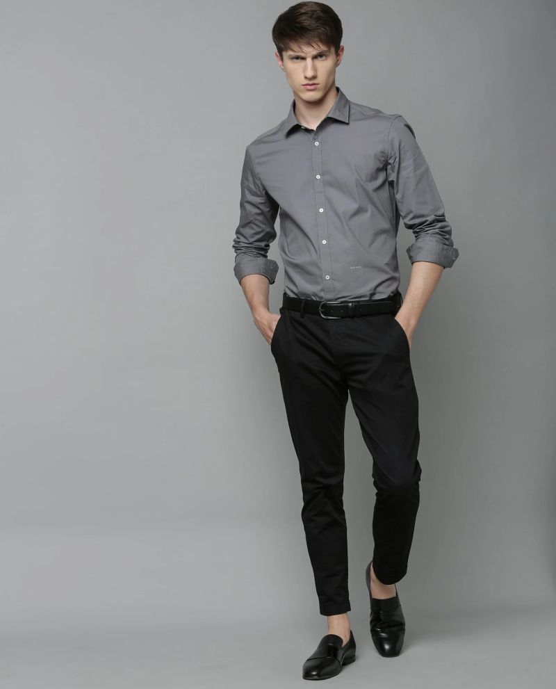 grey shirt with black slacks